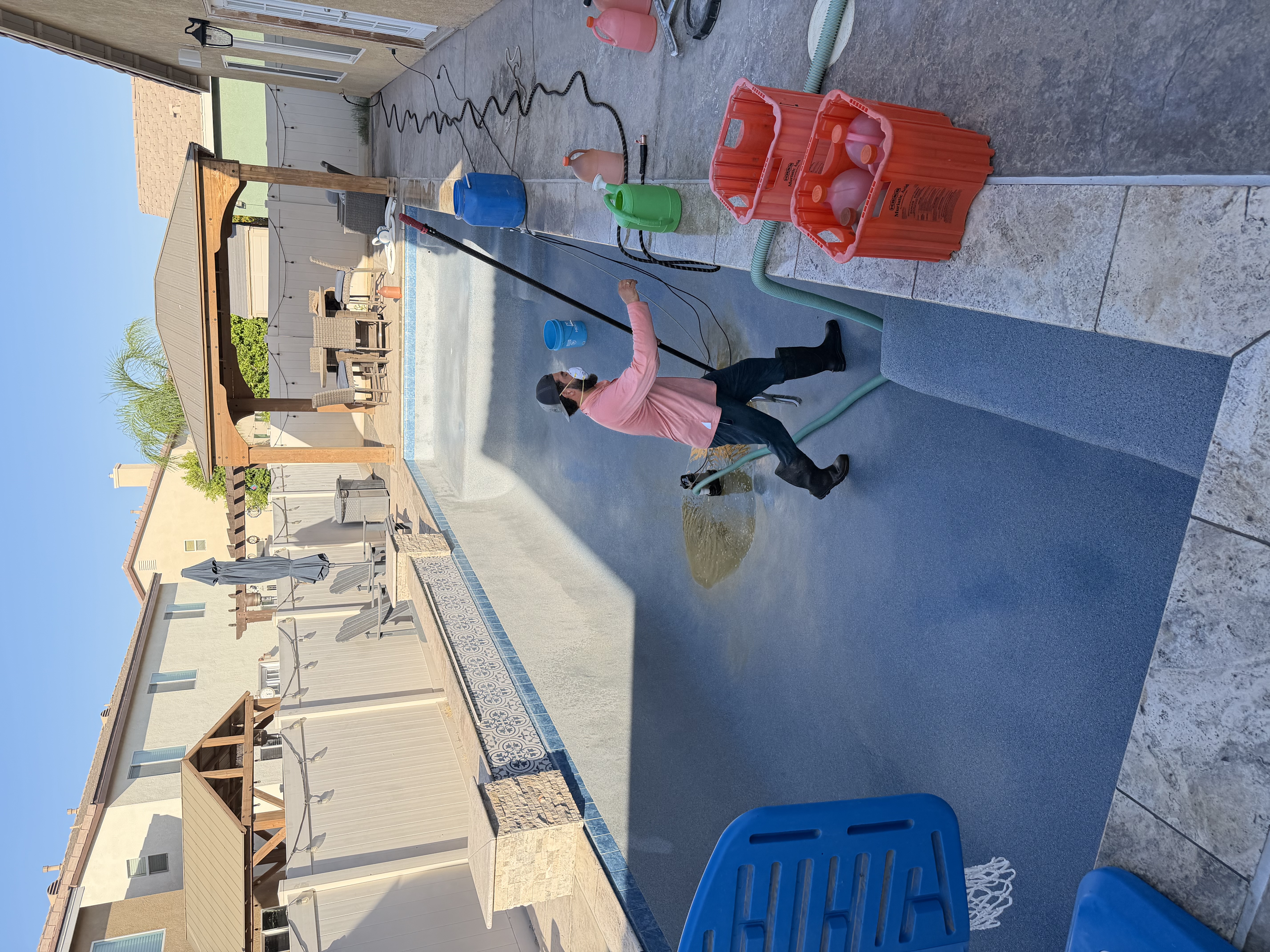 Scala Pools technician restoring a pool surface
