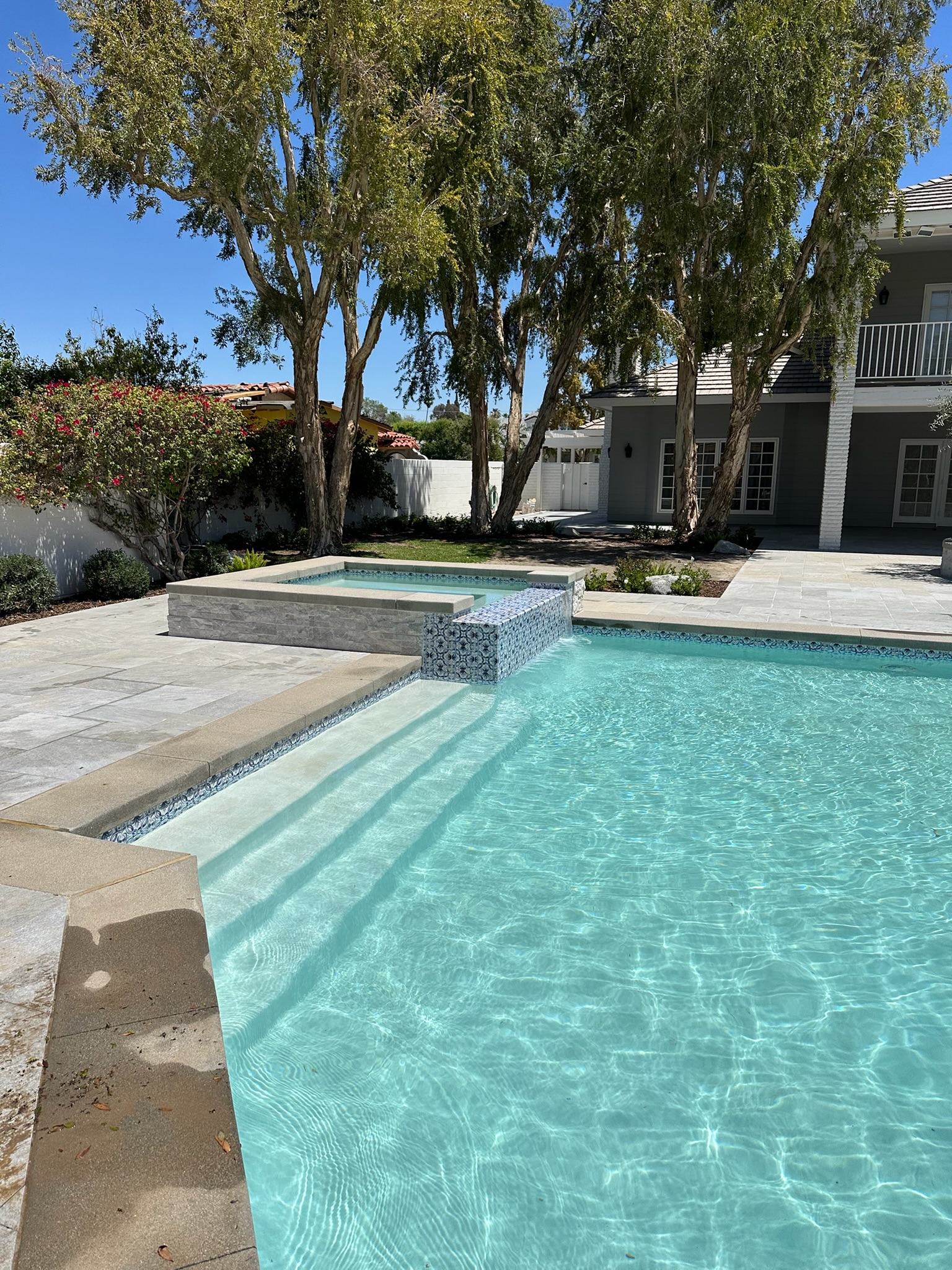 Bright pool with tiled spa